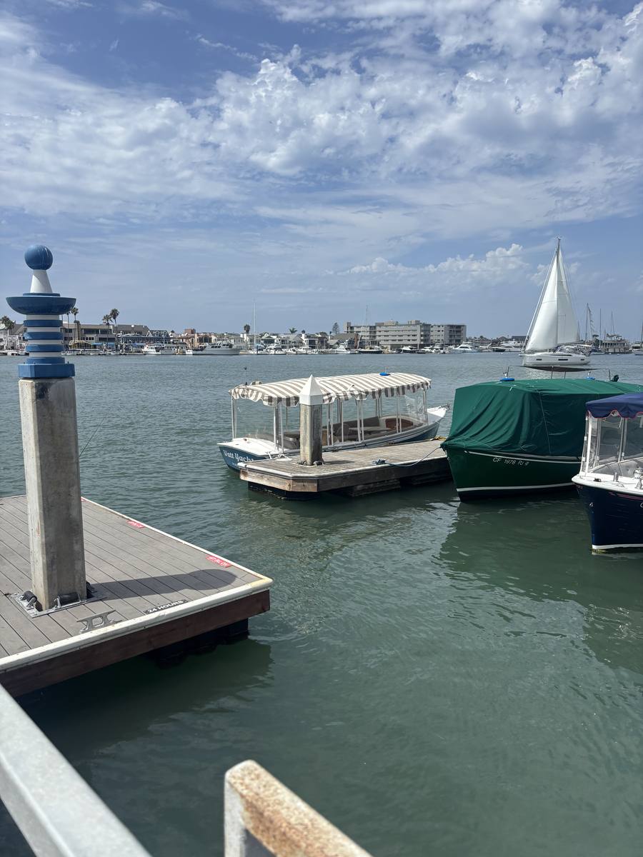 Duffy boats tied up at a dock on Newport Harbor