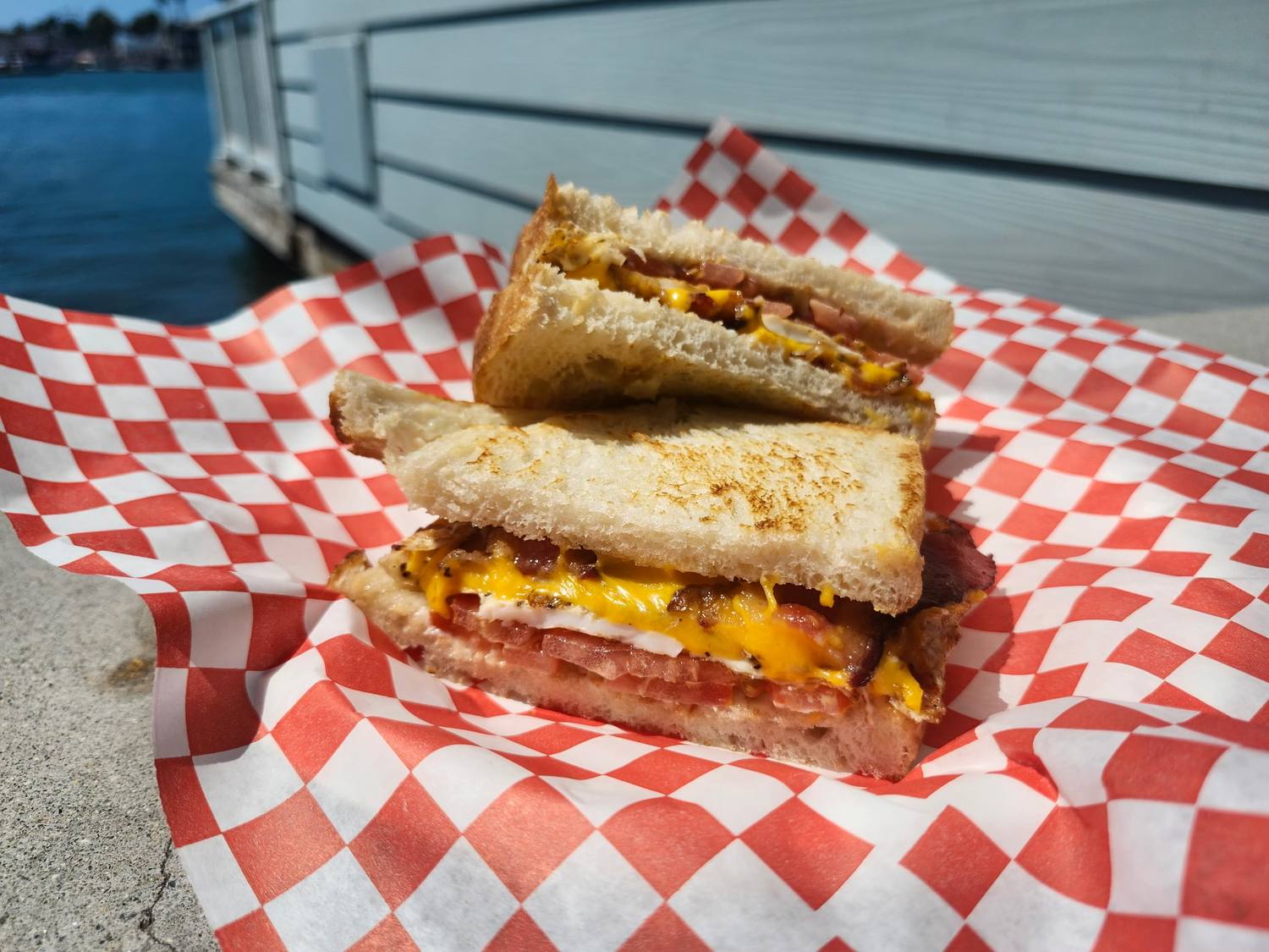 Grilled cheese with bacon, cut and stacked