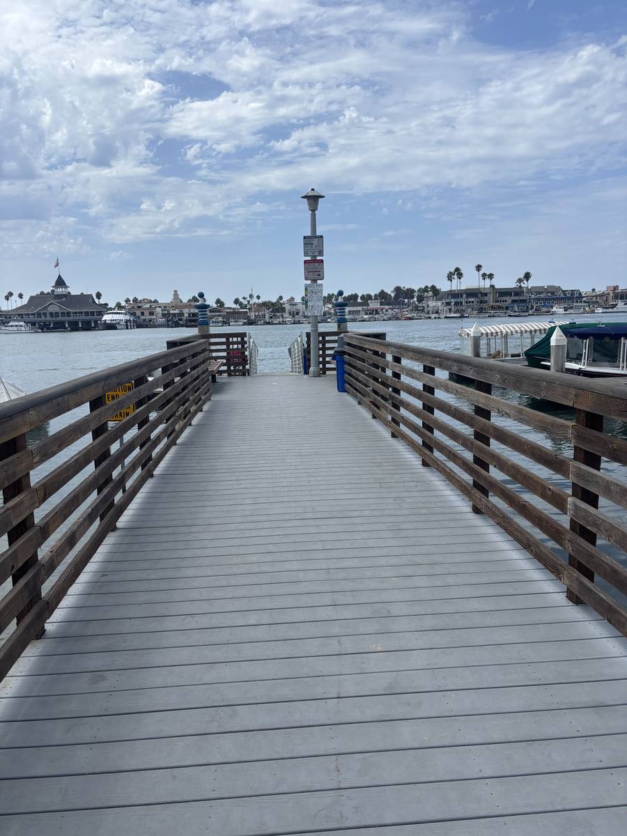 Wooden pier leading out over Newport Harbor
