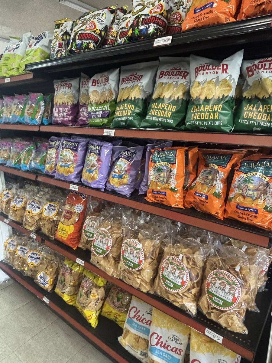 Snack aisle stocked with chips and crackers